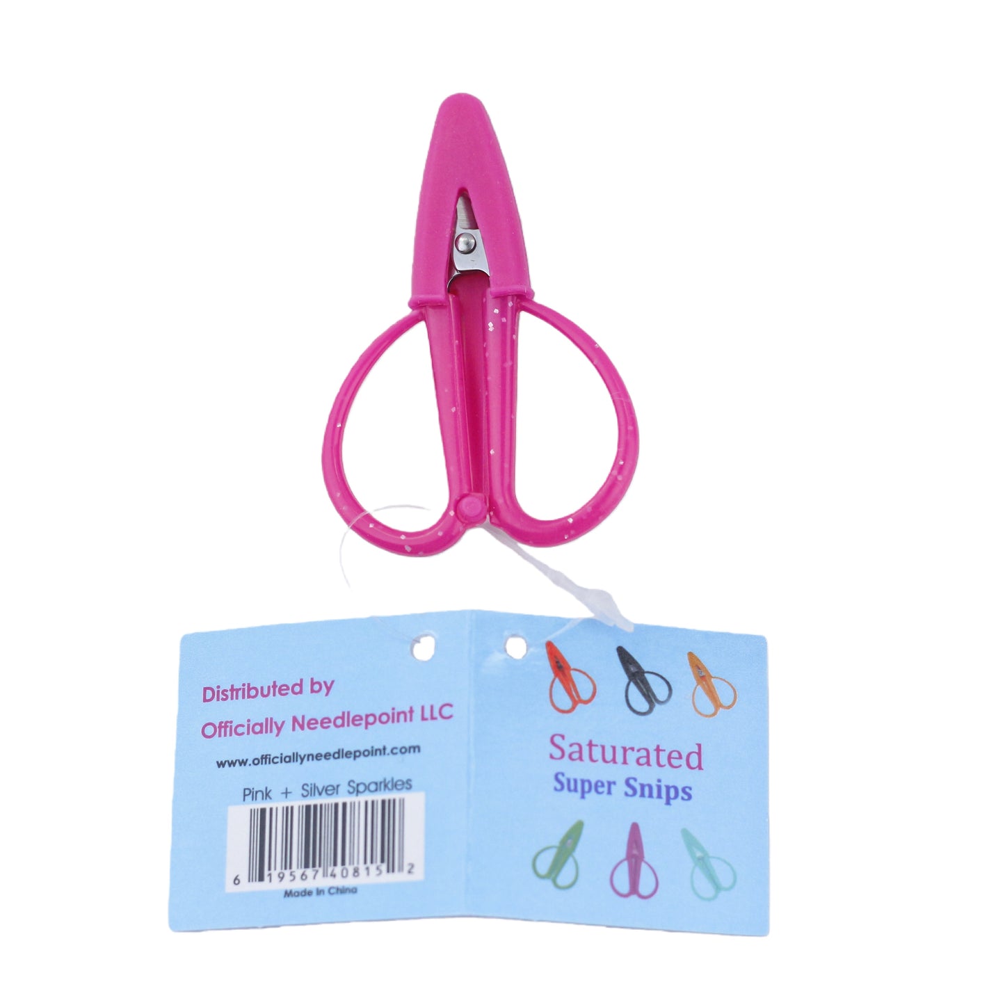 Bright Pink with Silver sparkles mini scissors with a blue packaging label on a white background